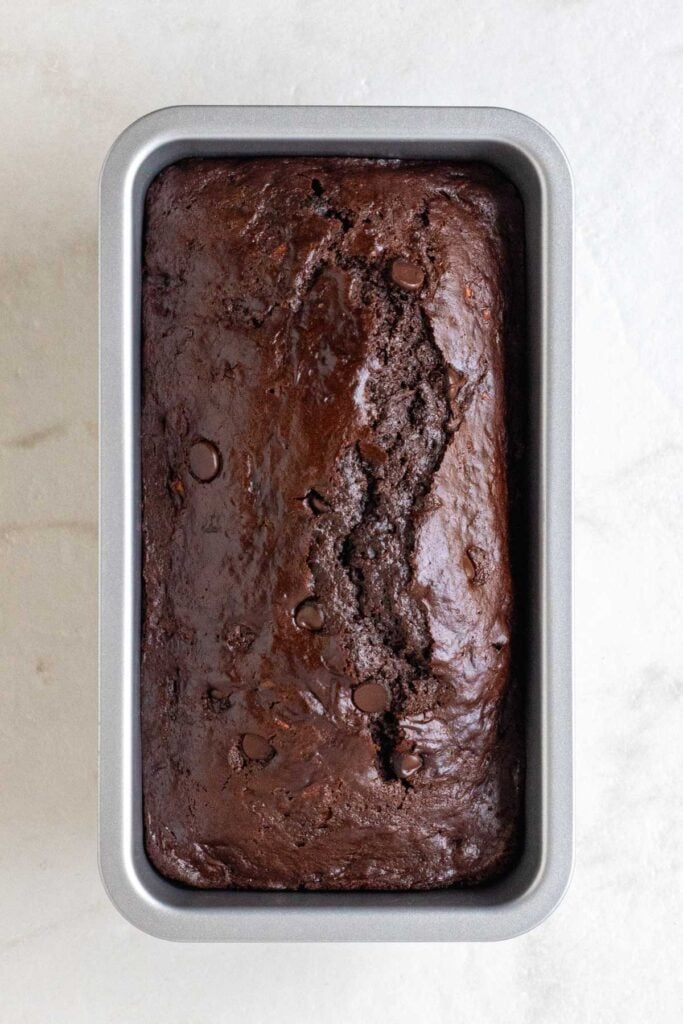 Baked chocolate zucchini bread in a loaf pan. 