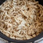 Close up of slow cooker shredded chicken.