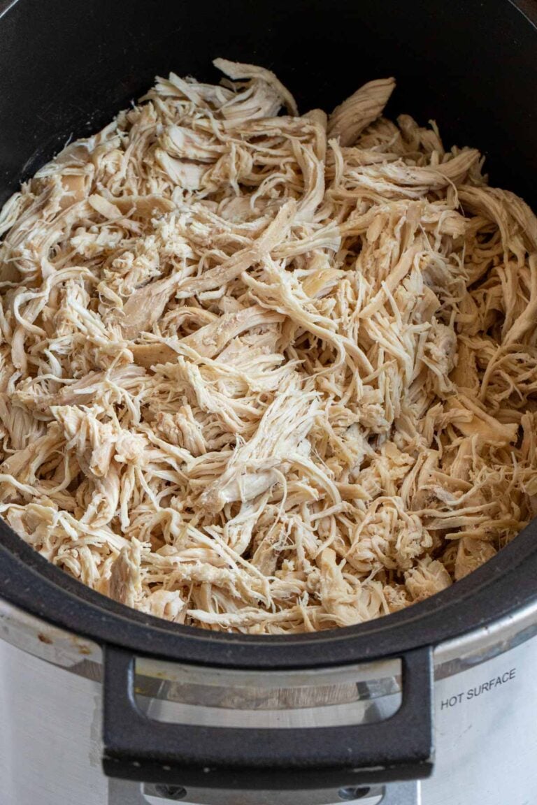 Close up of slow cooker shredded chicken.