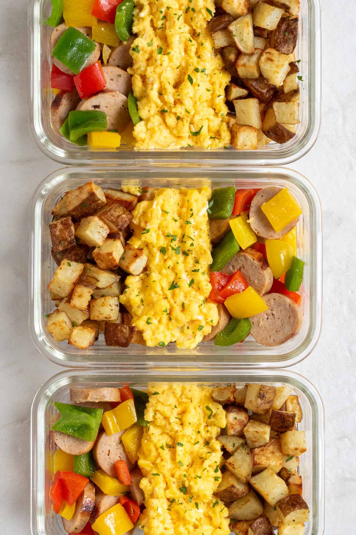 Line up of three high-protein breakfast meal prep bowls.