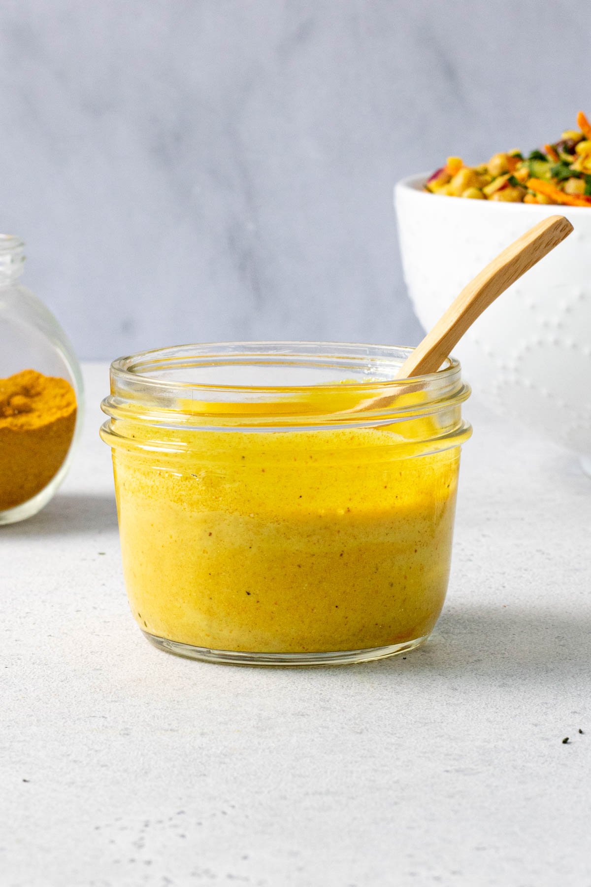 Jar of yogurt curry salad dressing.