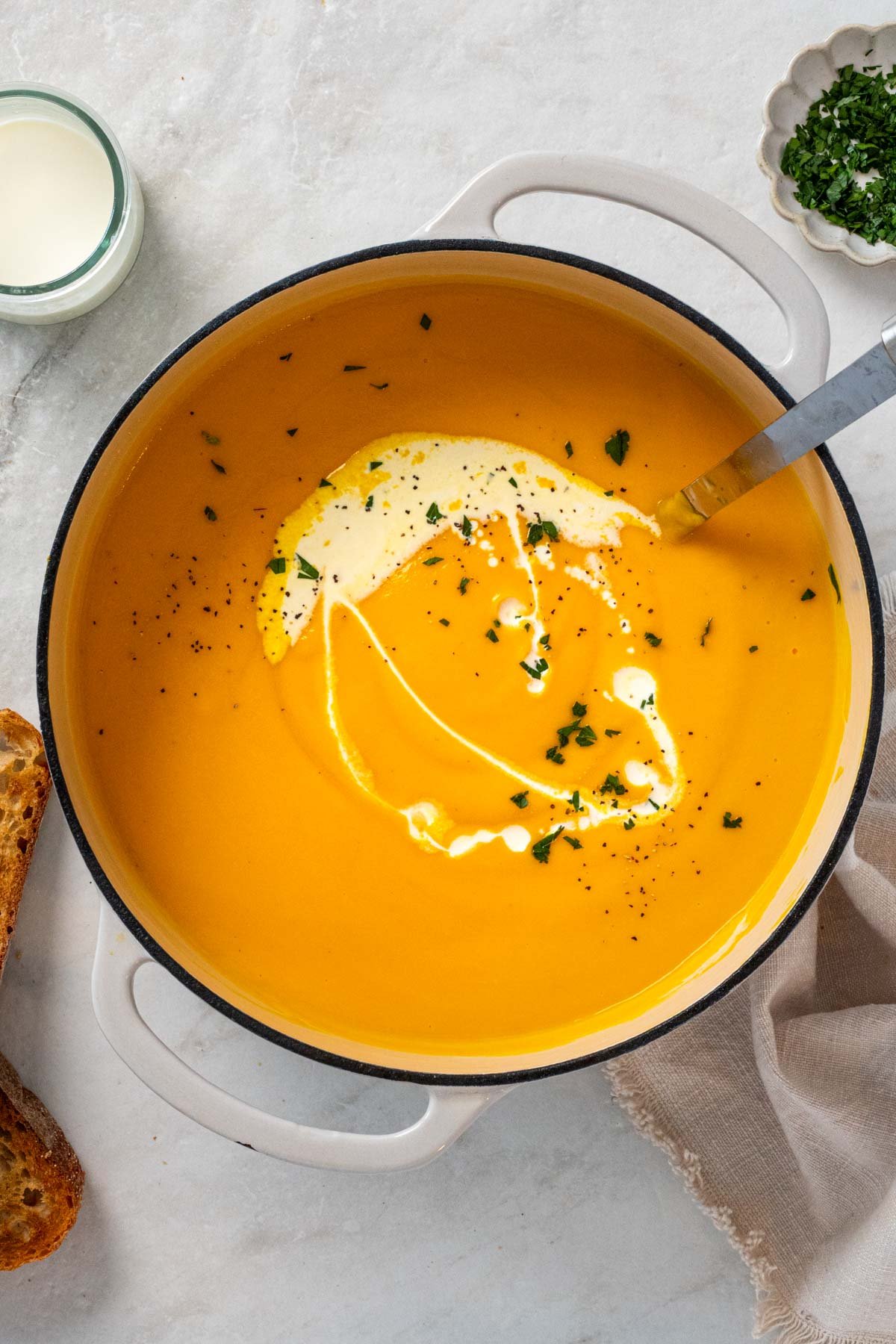 Dutch oven with creamy carrot and parsnip soup.