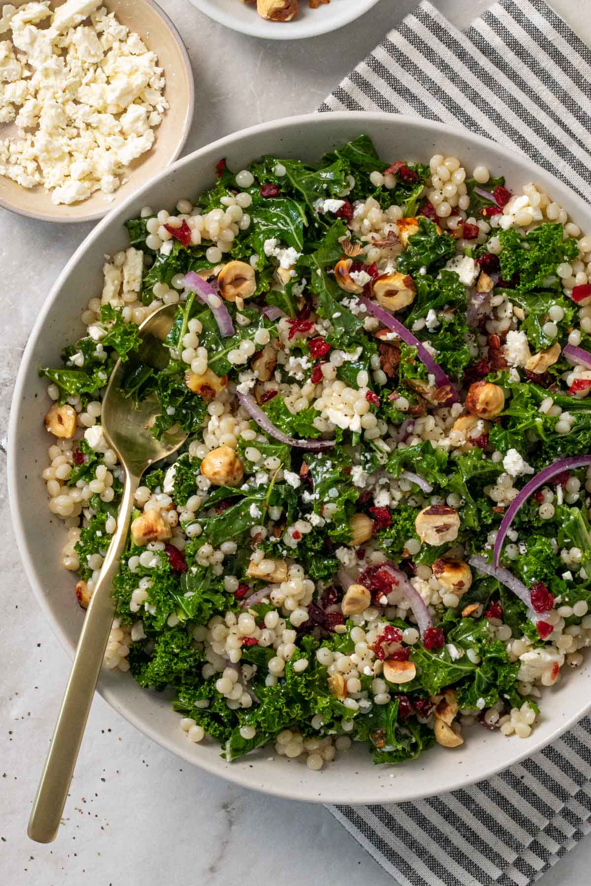 Bowl of kale couscous salad feta cheese.