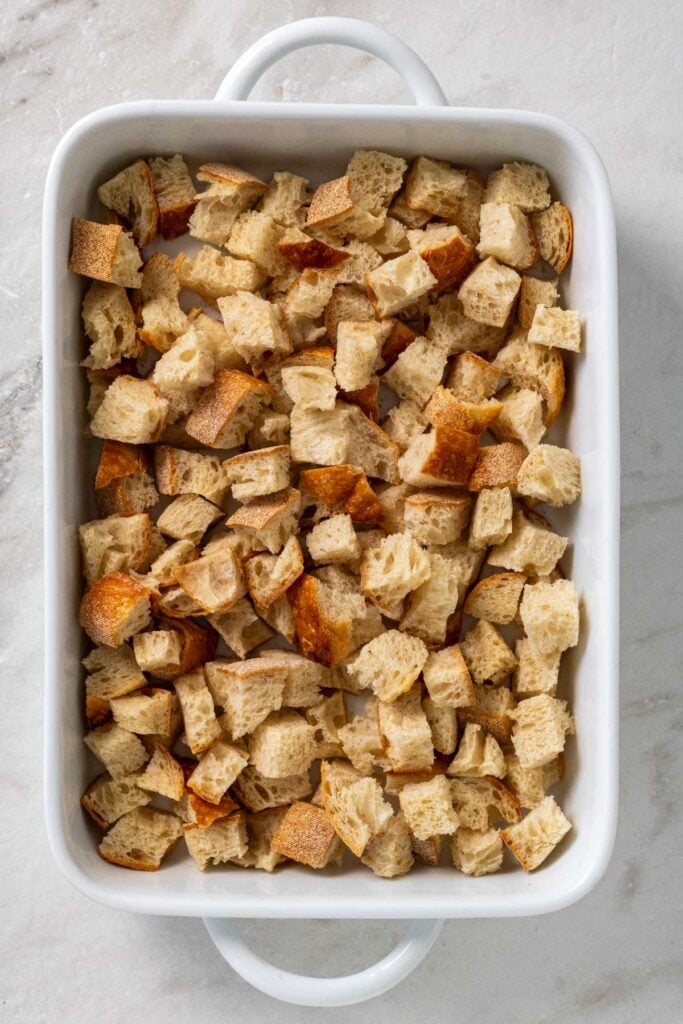 Baking dish day old Italian bread cubes.