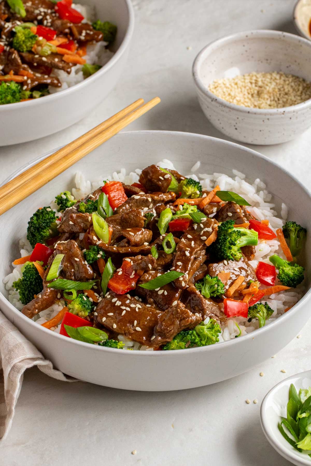 Close up beef teriyaki bowls on a white background.