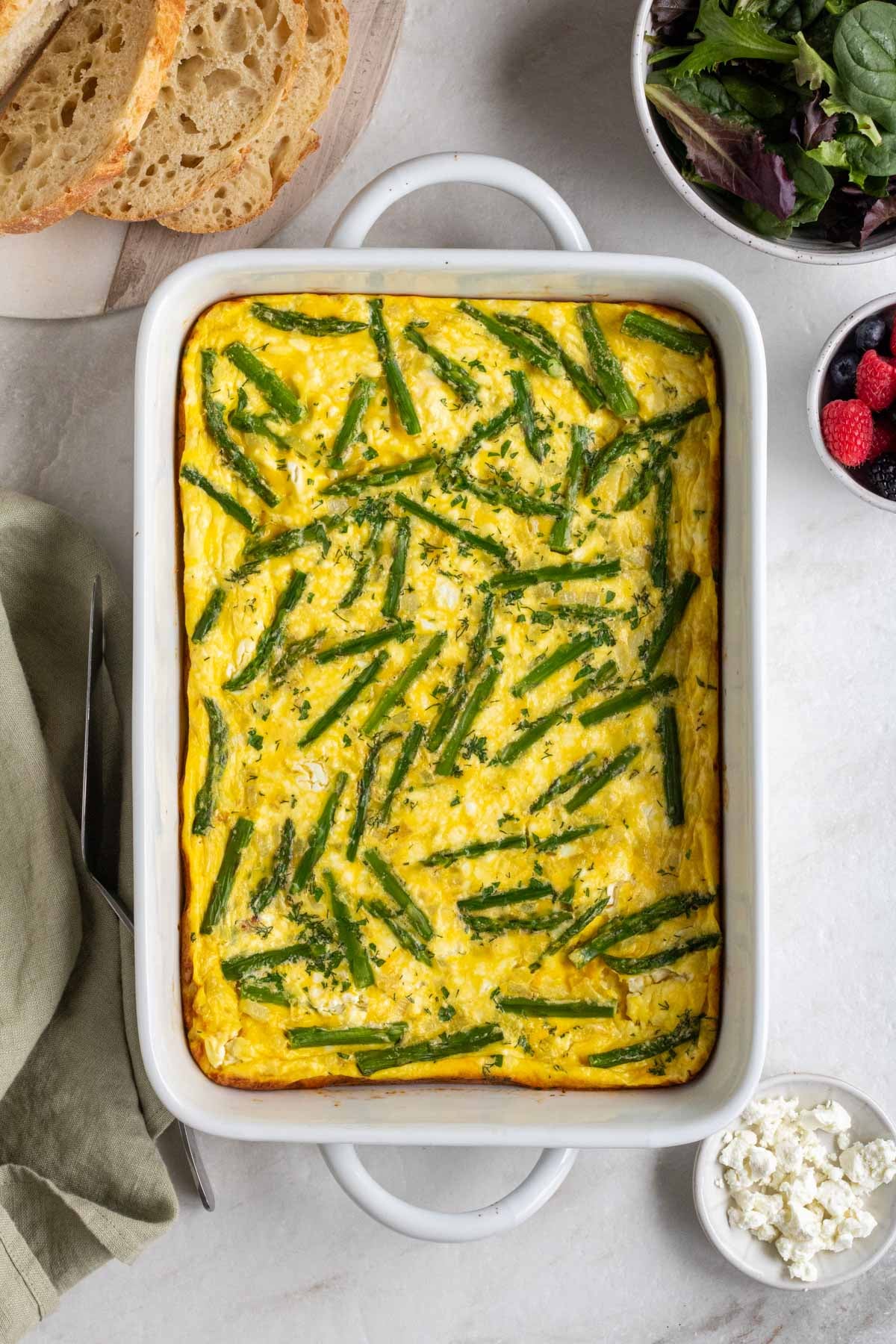 A baking dish of cooked asparagus breakfast casserole.