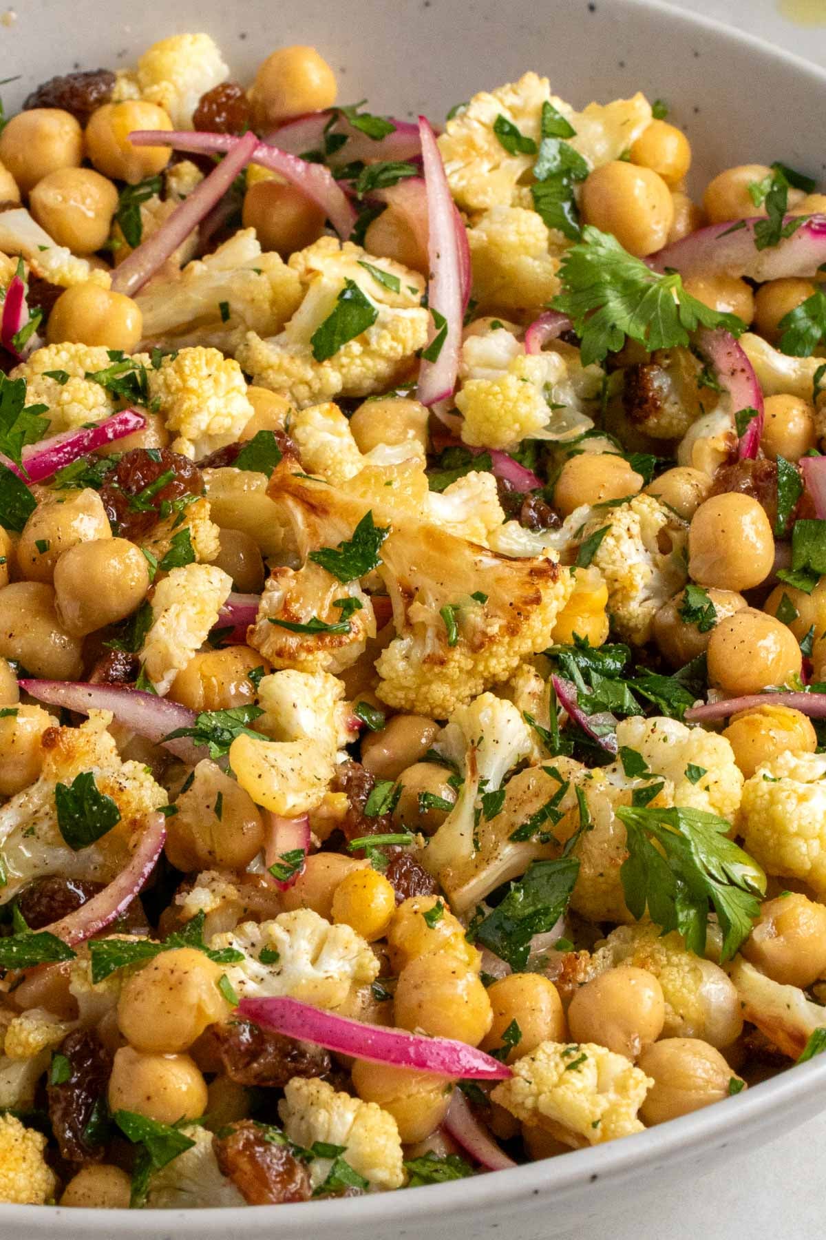 Close up of roasted cauliflower salad with chickpeas. 