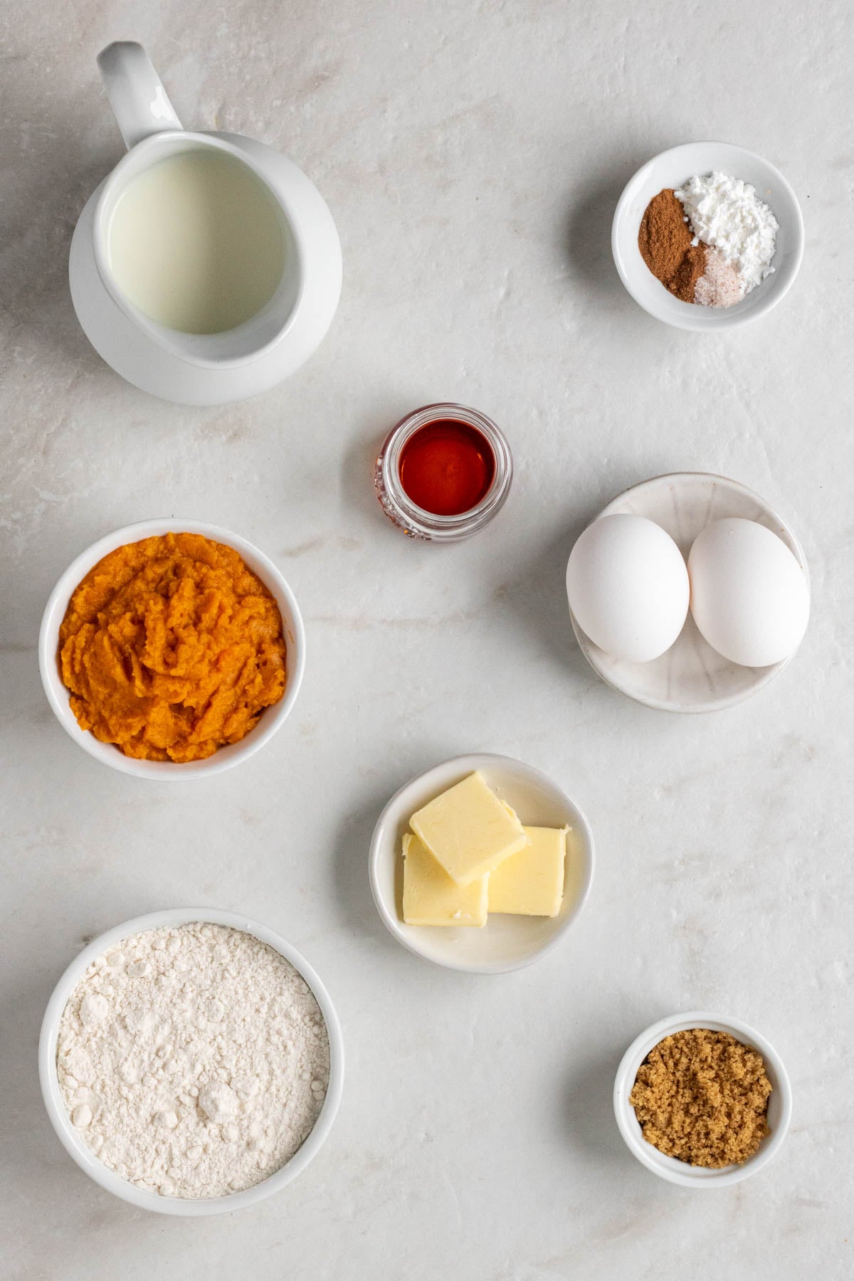 Grid of 4 images with a bowl of mashed sweet potato, eggs, brown sugar, and vanilla extract; a bowl of mashed sweet potato, eggs, brown sugar, vanilla extract, and milk; a bowl of mixed wet ingredients and dry ingredients on top; and a bowl of sweet potato pancake batter.